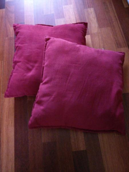 Pair of red cushions