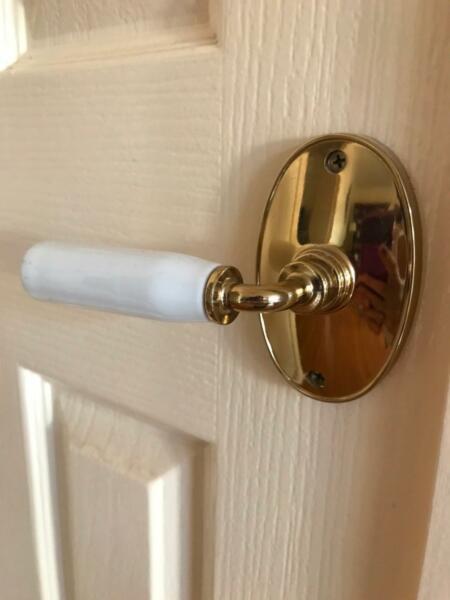Classic porcelain and brass doorknobs