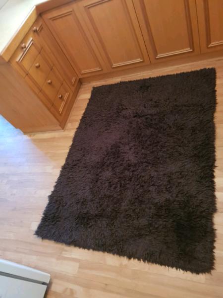 Chocolate coloured floor rug