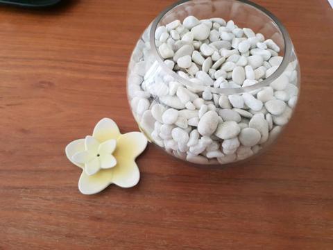 White pebbles in fish bowl decorative item