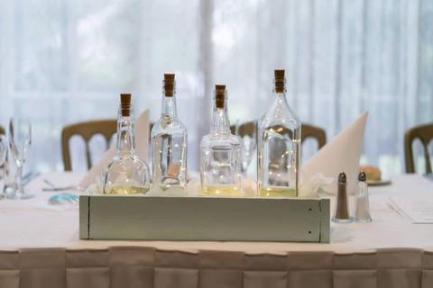 Wedding centerpiece timber planter box with glass bottles