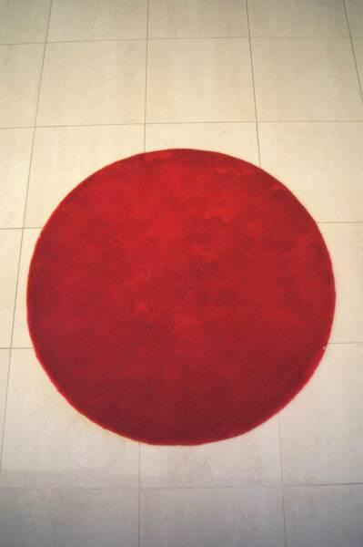 Small round red rug