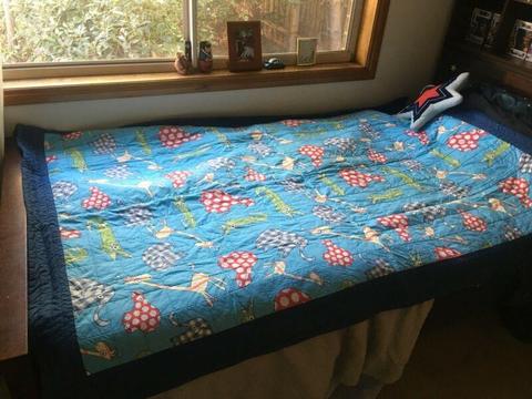 Animal themed quilted cotton bed throw