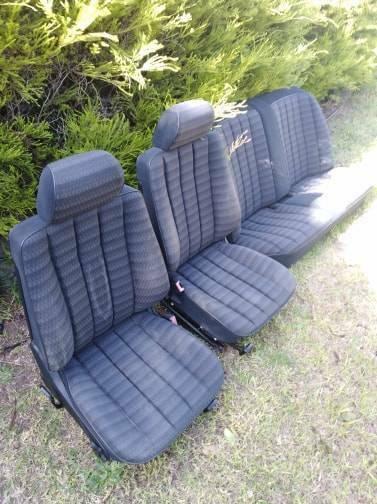 Mercedes 180E Black cloth seats, with seat covers