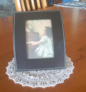 Frame with Child at the Piano Singing