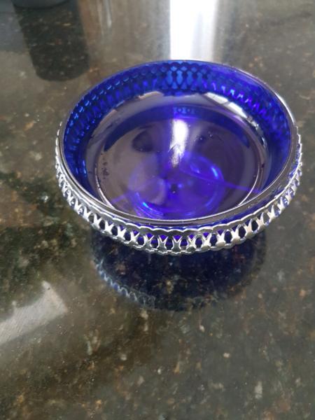 Blue glass bowl in silver decorative holder
