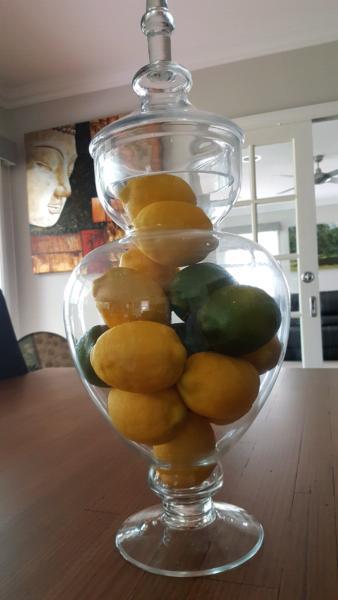 Large glass jar filled with artificial fruit