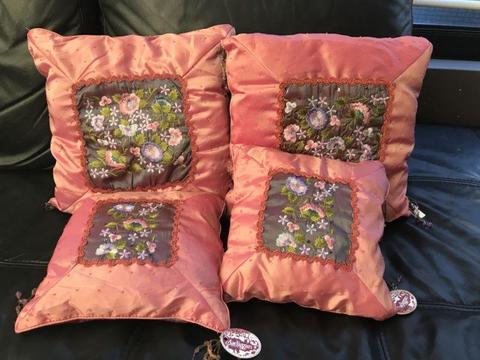 Decorative cushions, embroidered