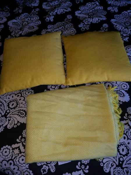 Yellow pillows and throw