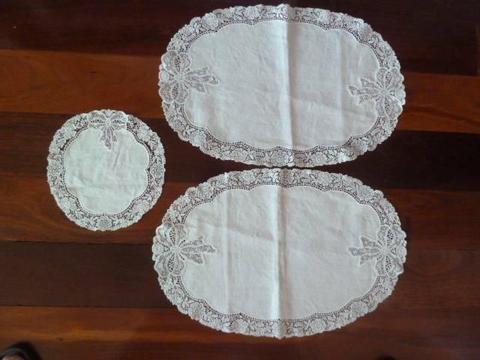 3 lace doilies. 2 large ones and one small one