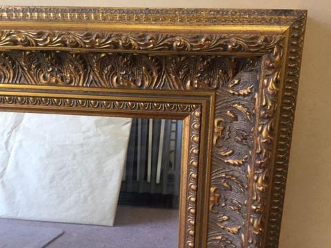 Gold ornate wall mirror $150