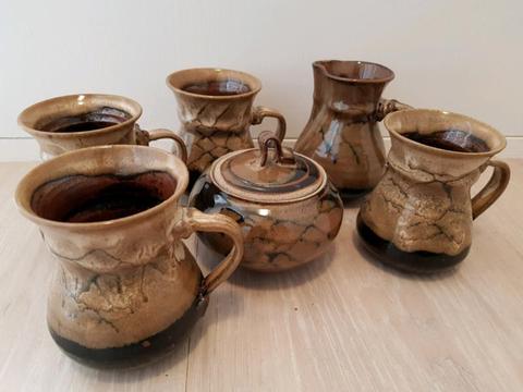 Pottery coffee mugs, sugar bowl, milk jug