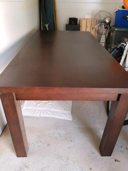 Solid dark stain timber dining table