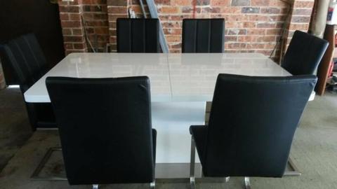 White table & 6 black chairs