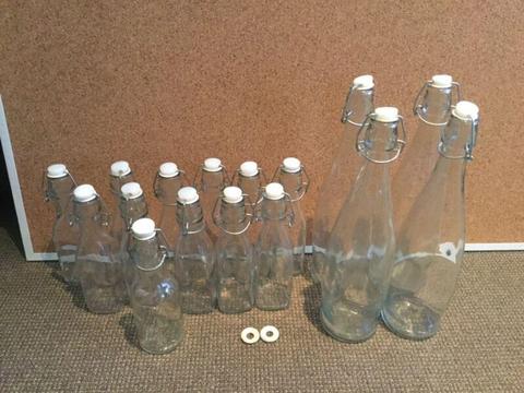 Bulk lot of 16 flip top glass bottles