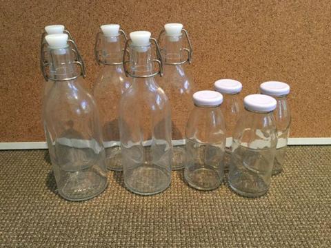 5 IKEA glass flip top bottles and 4 milk bottles bundle