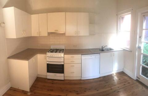 Kitchen cabinets, bench top, sink, tap and exhaust fan