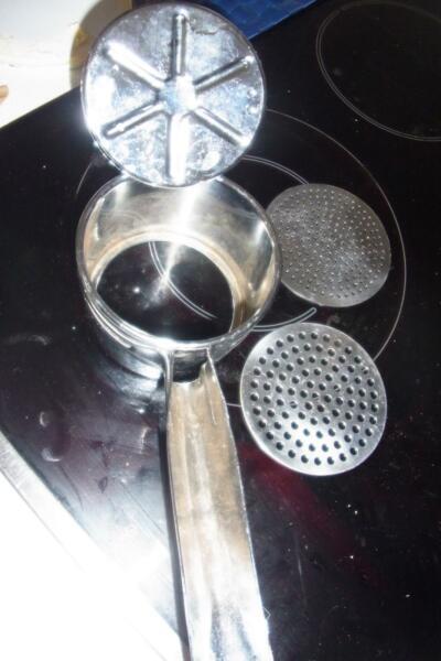 hand masher with x 2 different size holes great for pots and ect