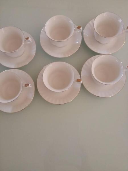 6 WHITE TEACUPS/SAUCERS WITH GOLD TRIM. WAS $20. NOW $10