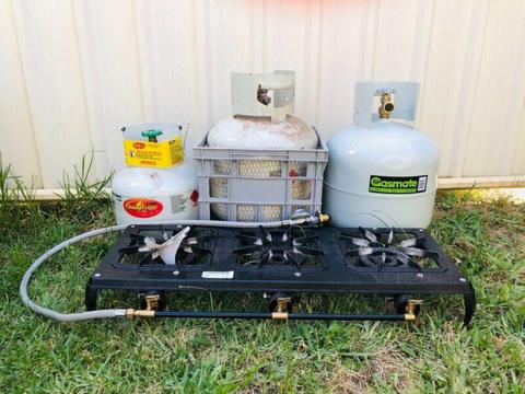 Outdoor gas stove and three barbecue gas bottles