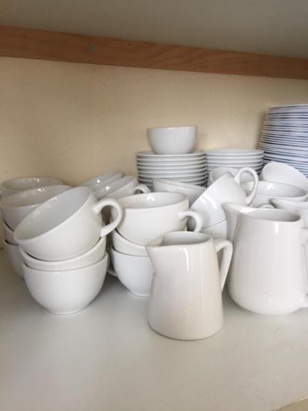 Thirty six restaurant quality Cups and saucers and milk jugsf