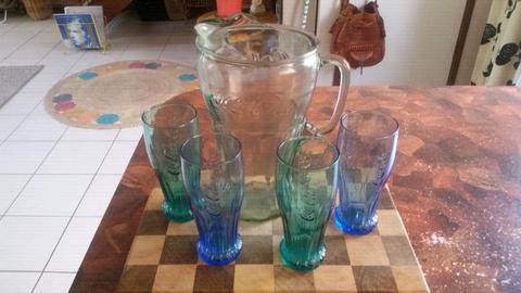 Coca-Cola jug and 4 glasses