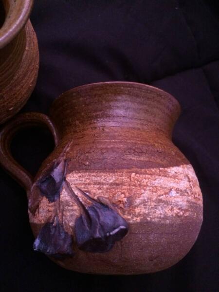 Set of four pottery/ceramic mugs brown with gumnut decoration