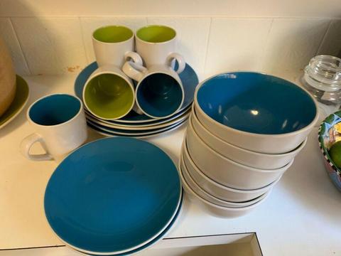 Set of colored bowls, mugs ,plates and table mats