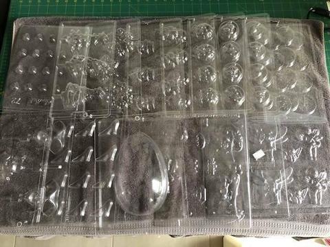 Lot of 25 Chocolate moulds, most new never used