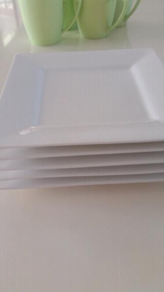Five white dinner plates/serving trays
