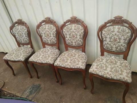 Carved timber dining chairs