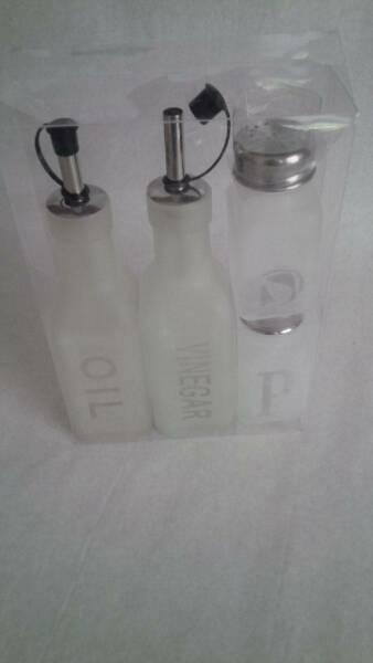 Set of four glass condiments