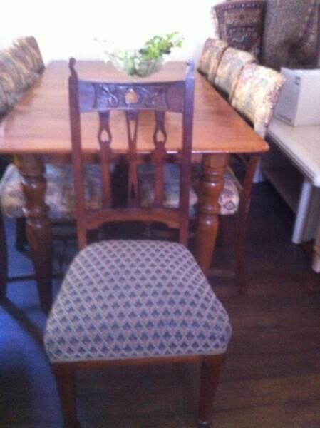 Carved upholstered antique dining chairs