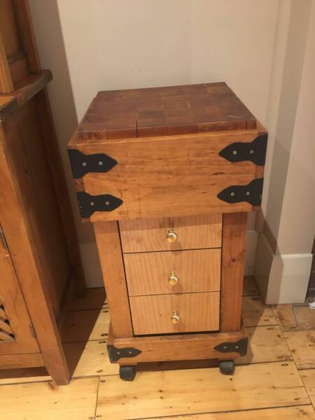 Wooden chopping block on wheels with 3 drawers