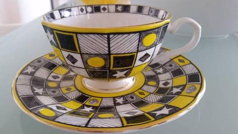 T2 tea cup and saucer. (Duo) yellow, black and gold