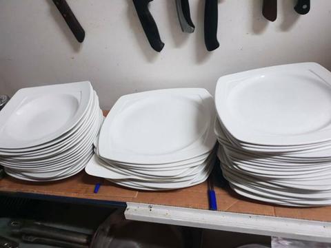 Plates, bowls and silver cutlery
