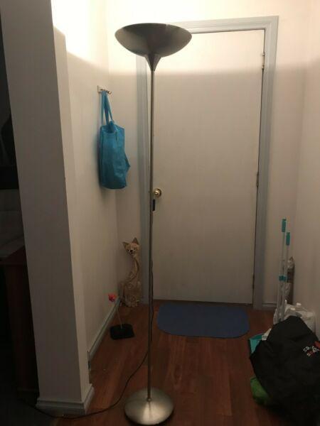 Tall stainless steel floor lamp in good working condition $25