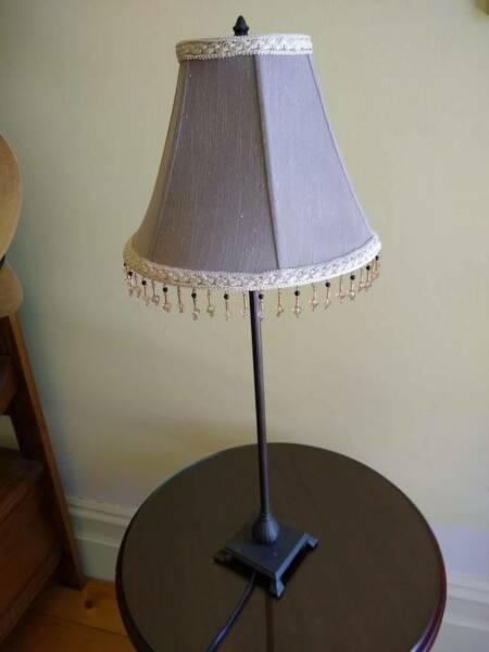 Table lamp. bronze-look metal base and beaded shade