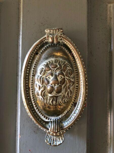 Antique brass lion knocker and knob
