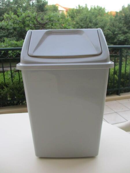 Grey plastic bin with swing lid