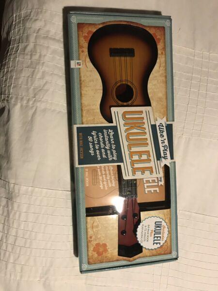 New, never opened ukulele- guitar