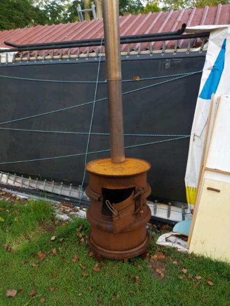 Outdoor wood fire heater made from truck rims