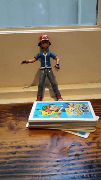 Pokemon cards and Ash with bending legs and arms