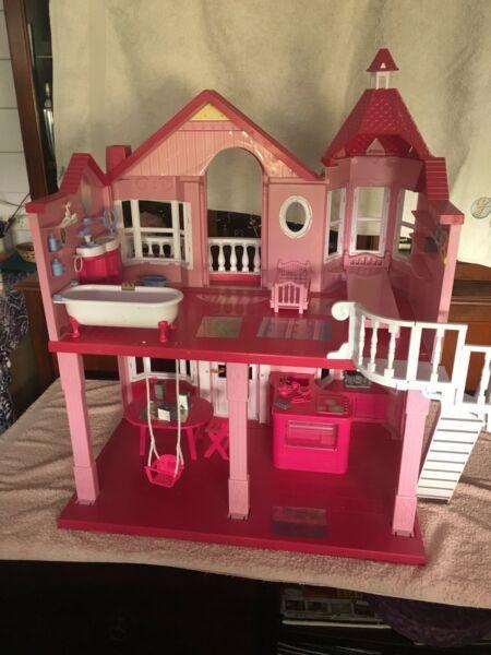 Dollhouse, barbie dolls and accessories