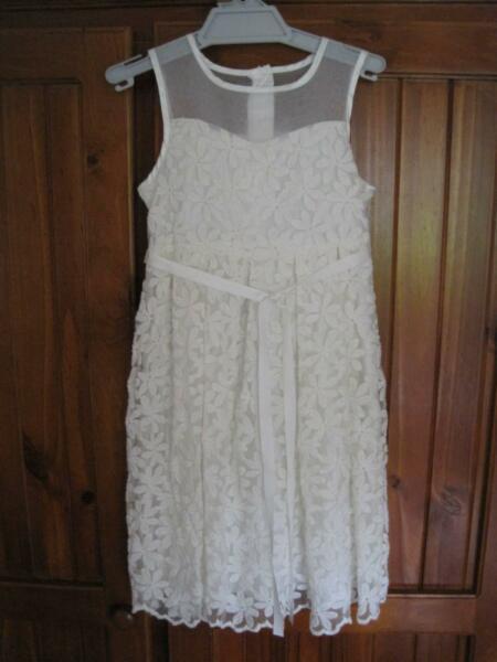 White dress, matching cardigan and shoes suitable for Communion