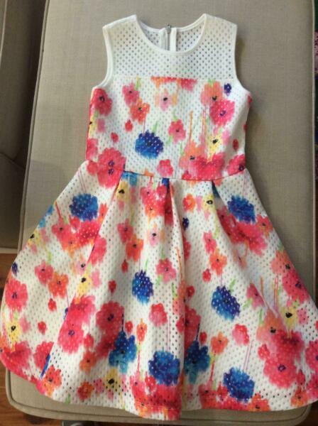 Size 9 girls Origami dress. White with colour flowers, never worn
