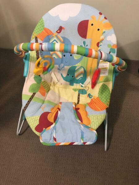 Colorful carnival baby bouncer in great condition