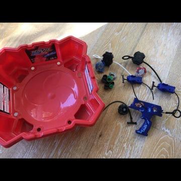 Beyblade arena stadium with beyblades burst and launchers