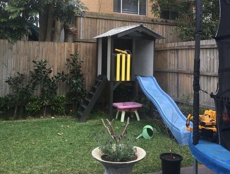 Cubby house with slide