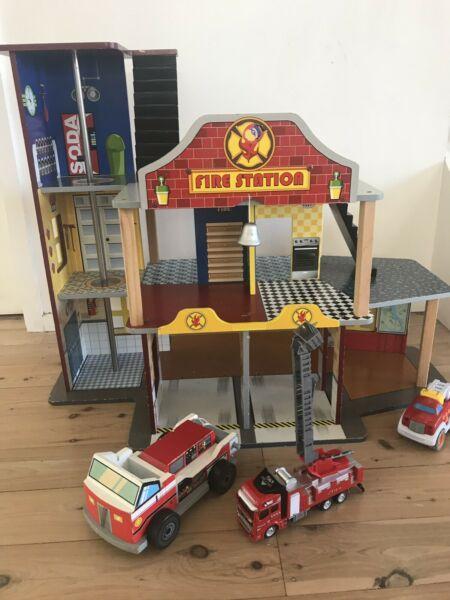 Wooden Fire station with fire truck toys